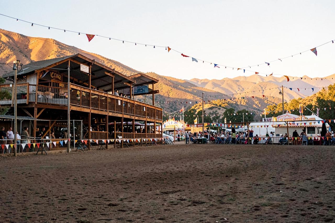 A county fairground grandstand and dusty arena in the California foothills