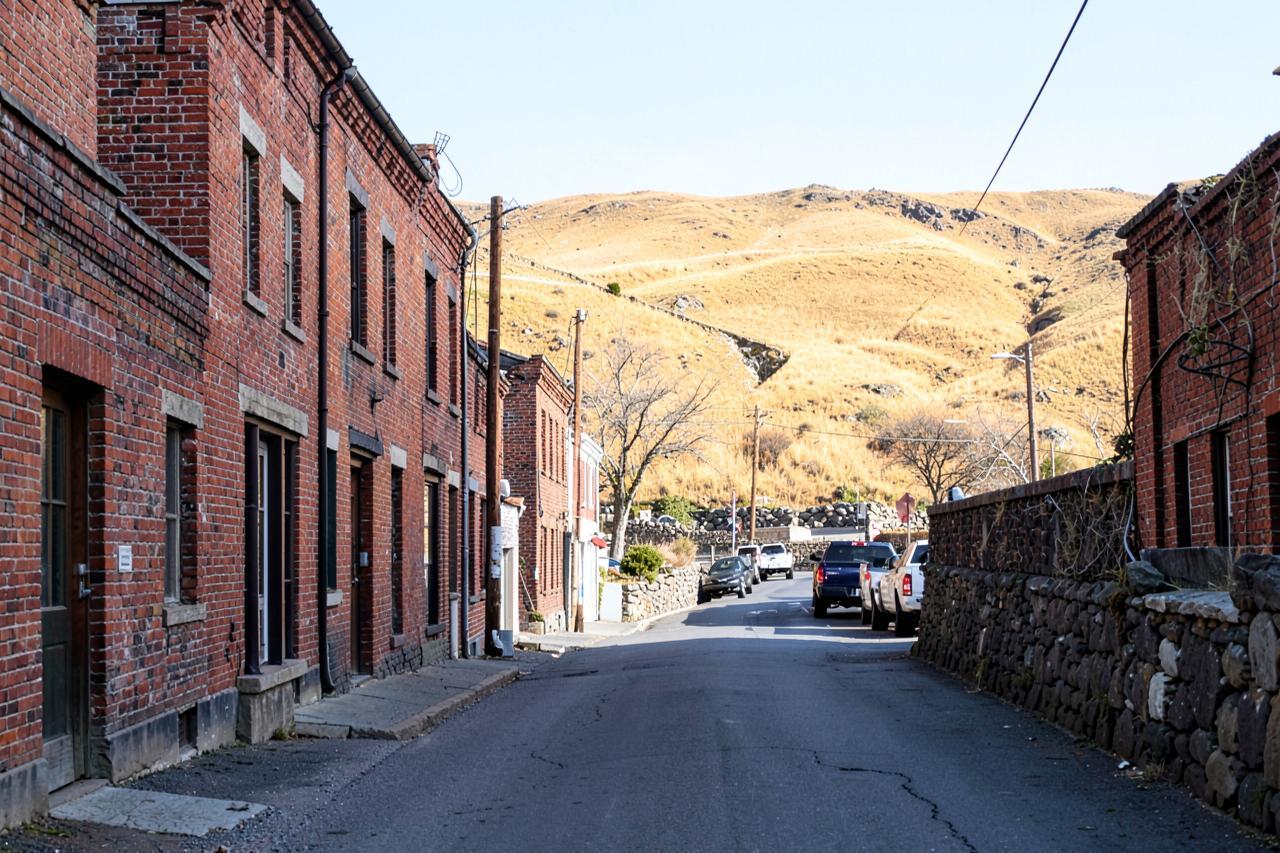 A short run of unrestored 19th-century brick buildings on San Andreas' old main street
